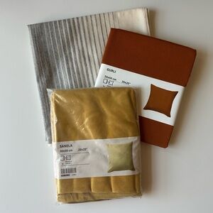 Set of Three IKEA Cushion Covers in Yellow, Orange, and Cream/Blue